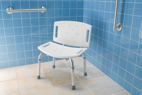 Adjustable shower chair with rubber-tipped legs