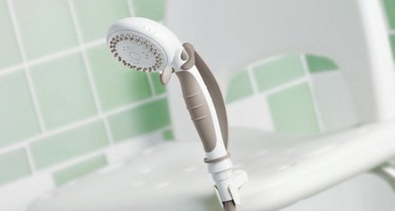 Handheld shower head with slide bar mounted in a shower